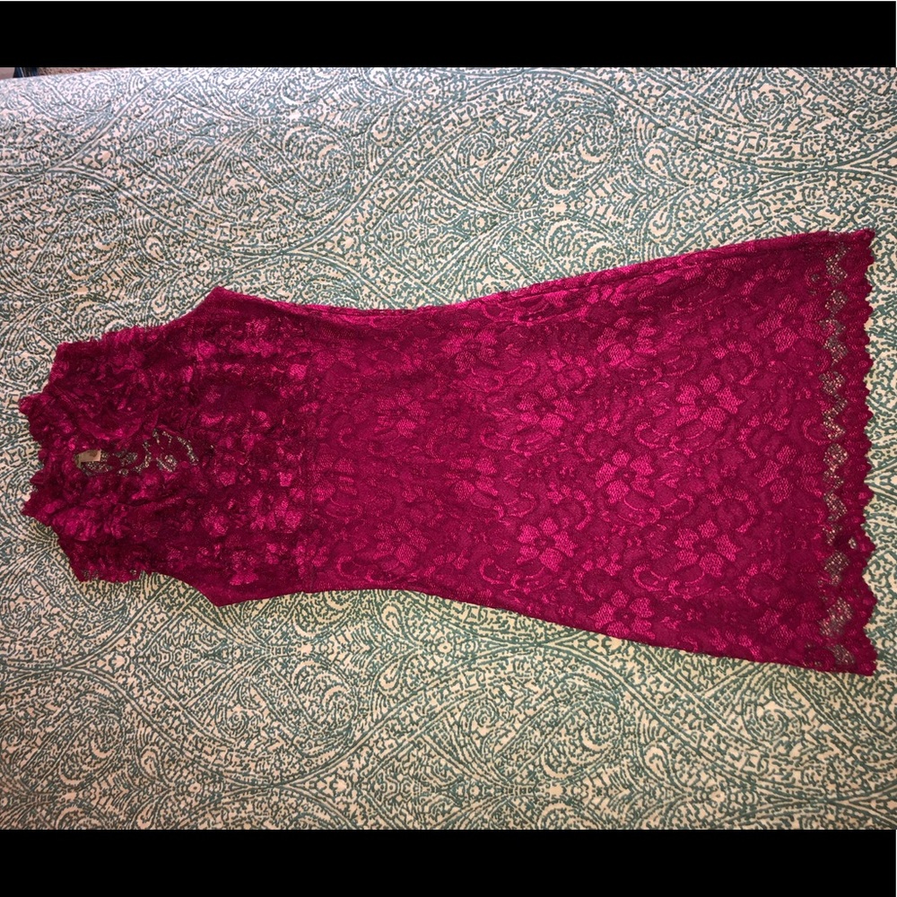 Fuchsia lace dress with ruffle neck & open back.
